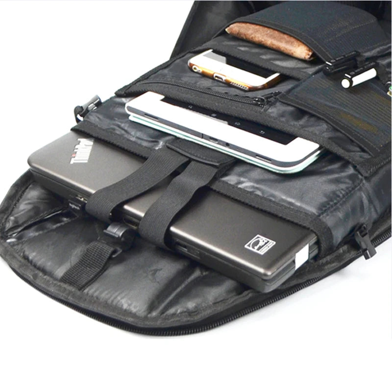 Black backpack with compartments for electronic devices on a white background