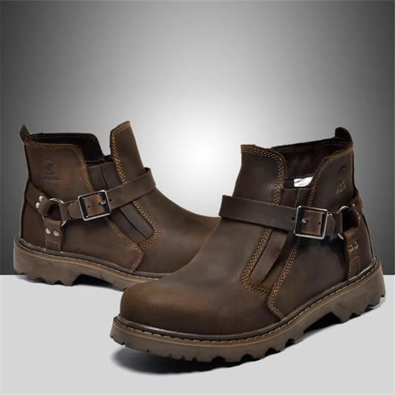 Pair of brown leather boots with buckles on a gray background