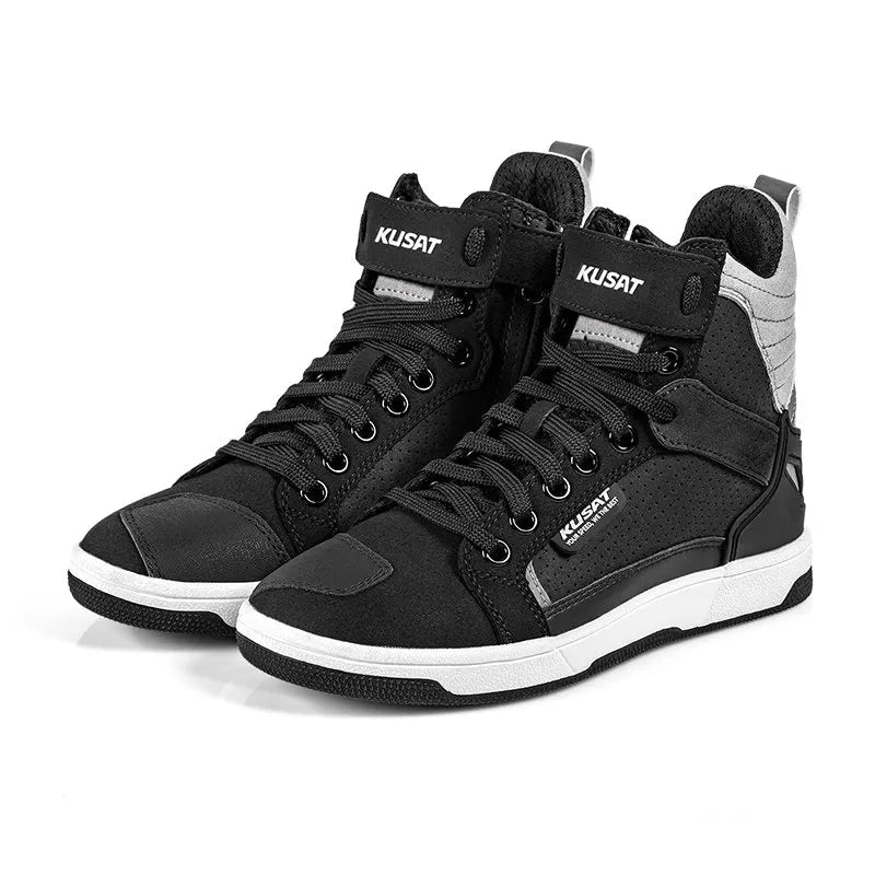Black high-top sneakers with white soles on a white background