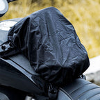 Black rain cover on a motorcycle seat with text about matching rain cover for outdoor weather conditions.