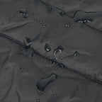 Water repellent material with text about fabric composition on a black surface