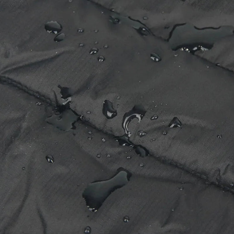 Water repellent material with text about fabric composition on a black surface